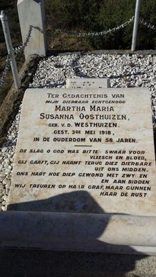 The grave of Martha Maria Susanna Oosthuizen, born van der Westhuizen (1859-1918), a flat marble ledger beside her...