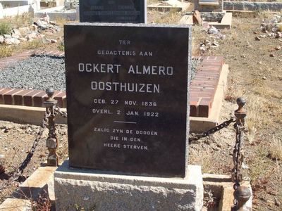 The grave of Ockert Almero Oosthuizen (1836-1922) in the Prince Albert DR church cemetery: a polished black granite...